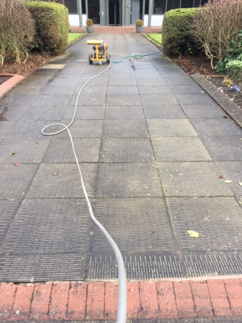 paved area in the process of being cleaned